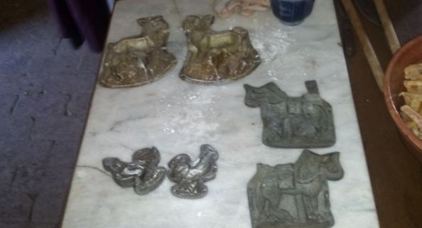 Some of the sugar molds used in the process... a rooster, stag, and horse. The bowl on the right, by the way, is full of candied orange peel. 